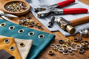 cómo poner ojetes en tela